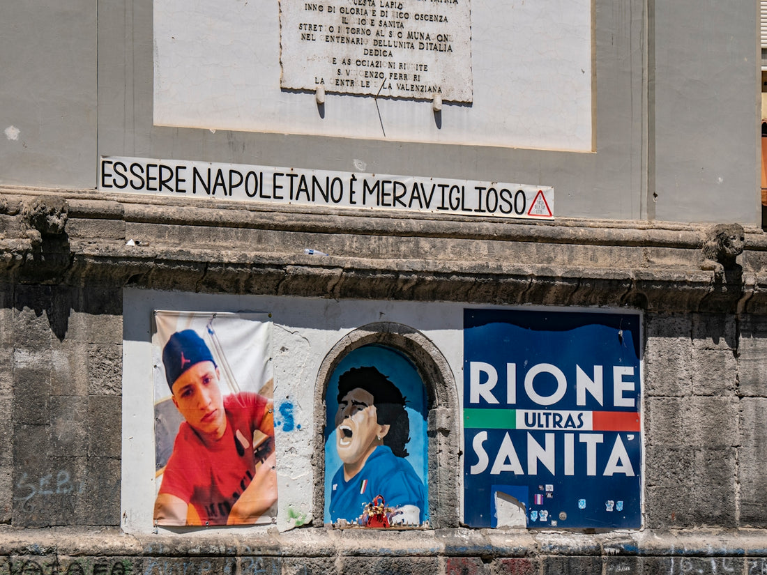 A building with a bunch of posters on the side of it