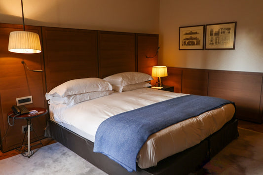 A cozy hotel bedroom with a large bed.